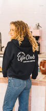 unisex blue navy sweater in a coffee shop