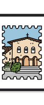 A framed art print featuring a stylized, stamp-like illustration of a beige church building with brown roof tiles, a blue sky, green shrubs, and gray steps, presented in a black frame against a white background.