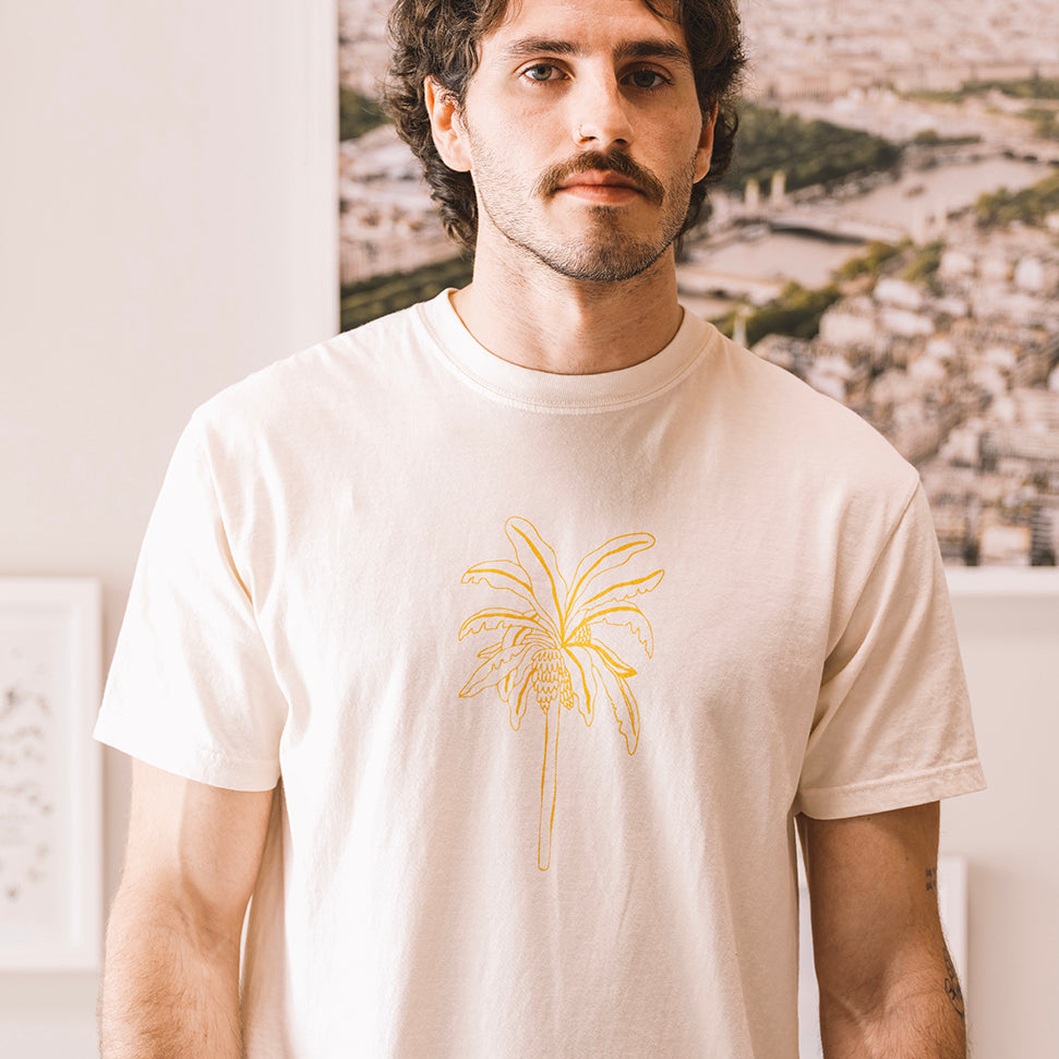 Man wearing a cream t shirt el banano in buen dia coffee