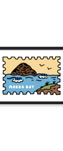 A framed art print featuring a stylized illustration of Morro Bay, with blue water, a brown rocky island, a beige sky, and the words 'MORRO BAY' in white. The print is shown in a black frame against a clean white background.