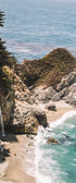 A photograph capturing Mcway Falls in Big Sur, California, with a backdrop of the Pacific Ocean and dramatic cliffs.